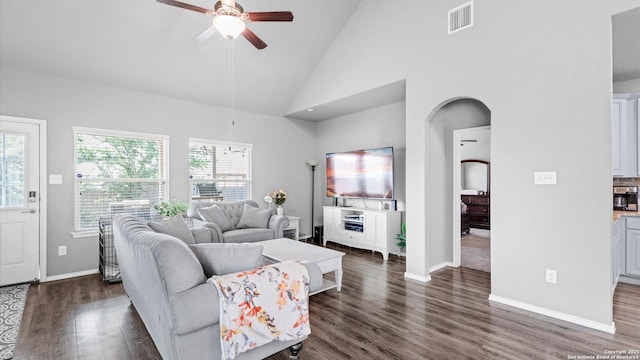 7110 Marina Del Rey, Converse, TX 78109 - living room with ceiling fan, healthy amount of natural light, dark wood-style floors, high vaulted ceiling, and baseboards