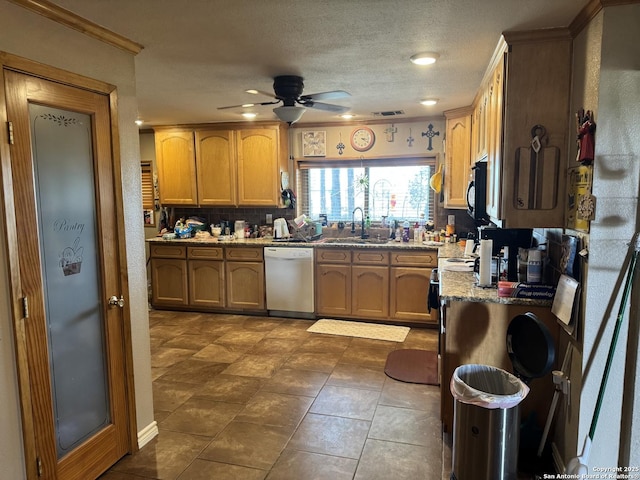 7084 Richter, Elmendorf, TX 78112 - kitchen with dishwasher, a sink, a ceiling fan, black microwave, and ornamental molding