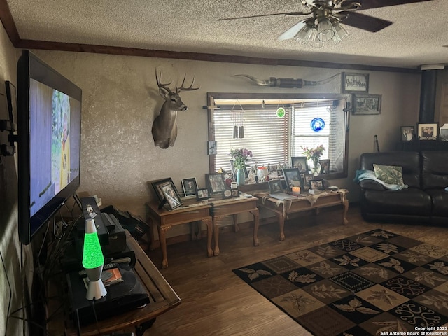 7084 Richter, Elmendorf, TX 78112 - living room with a textured ceiling, wood finished floors, ceiling fan, and a textured wall