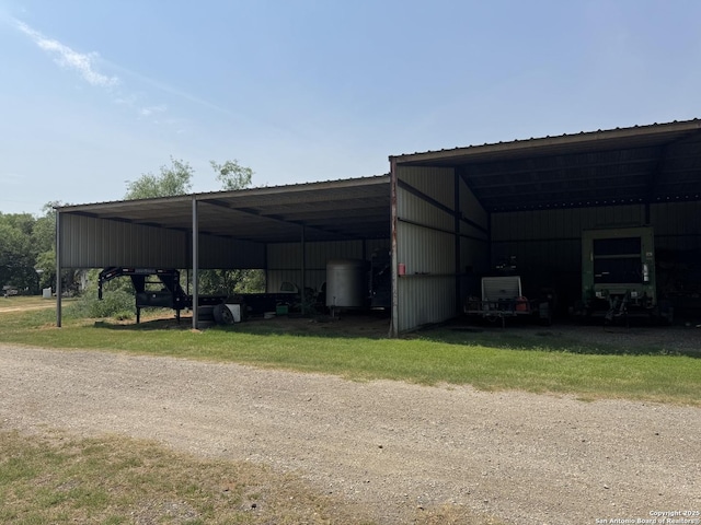 7084 Richter, Elmendorf, TX 78112 - view of pole building featuring a detached carport and driveway