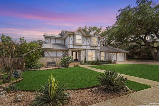 1946 Encino Belle, San Antonio, TX 78259 - tudor home with stone siding, concrete driveway, an attached garage, metal roof, and stucco siding