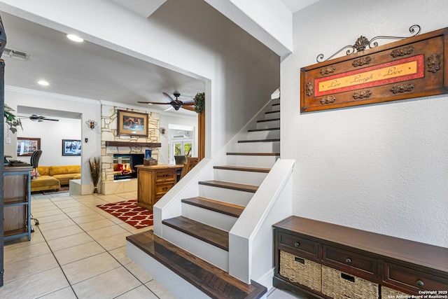 1946 Encino Belle, San Antonio, TX 78259 - stairway featuring a ceiling fan, a fireplace, tile patterned flooring, ornamental molding, and recessed lighting