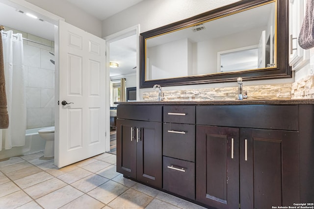 1946 Encino Belle, San Antonio, TX 78259 - bathroom featuring double vanity, tile patterned flooring, toilet, and shower / bath combo