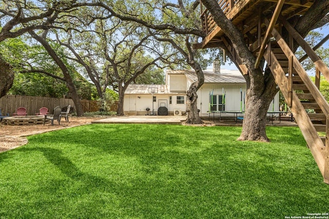 1946 Encino Belle, San Antonio, TX 78259 - back of property with a patio area, a fire pit, and metal roof