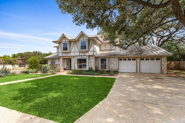 1946 Encino Belle, San Antonio, TX 78259 - tudor home featuring stone siding, a standing seam roof, driveway, metal roof, and a garage