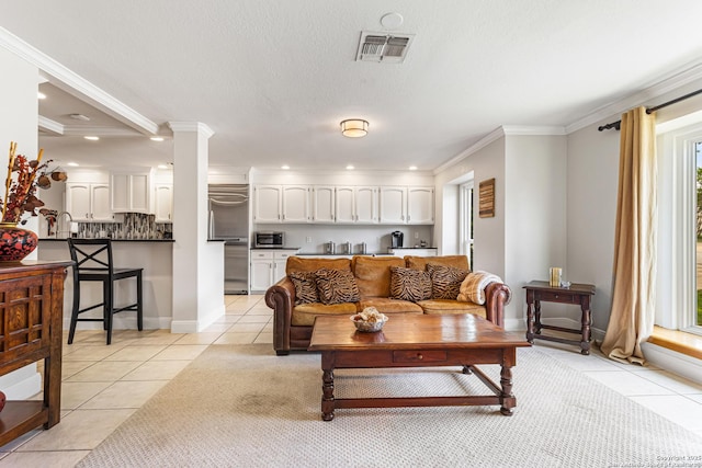 1946 Encino Belle, San Antonio, TX 78259 - living area featuring light tile patterned flooring, recessed lighting, ornamental molding, and ornate columns
