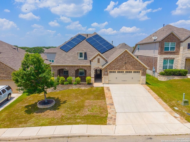 12827 Sabinal Riv, San Antonio, TX 78253 - french country inspired facade with an attached garage, driveway, a front yard, solar panels, and roof with shingles