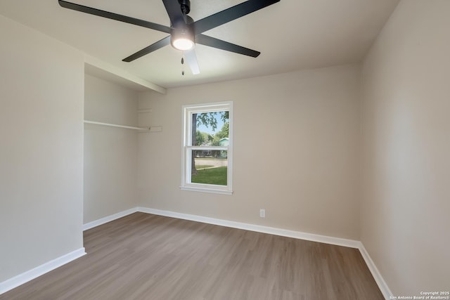 142 W Palfrey, San Antonio, TX 78223 - empty room featuring wood finished floors, baseboards, and a ceiling fan