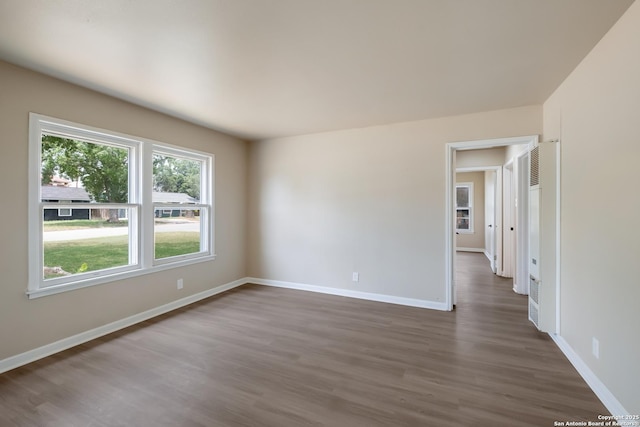 142 W Palfrey, San Antonio, TX 78223 - spare room featuring dark wood-style flooring and baseboards