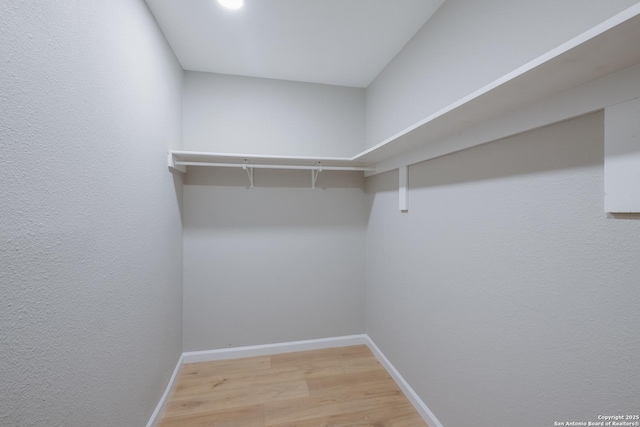 6723 Hickory Springs Dr, San Antonio, TX 78249 - walk in closet featuring wood finished floors