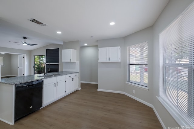 6723 Hickory Springs Dr, San Antonio, TX 78249 - kitchen with black dishwasher, a sink, a peninsula, white cabinets, and light wood-style flooring