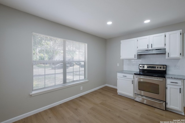 6723 Hickory Springs Dr, San Antonio, TX 78249 - kitchen with electric range, under cabinet range hood, white cabinetry, baseboards, and recessed lighting