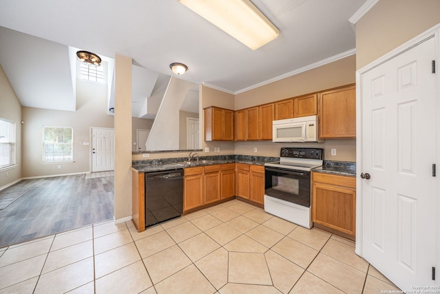 20519 View Mdw, San Antonio, TX 78258 - kitchen with white microwave, range with electric stovetop, dishwasher, a sink, and light tile patterned floors