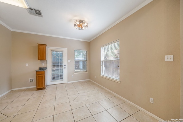 20519 View Mdw, San Antonio, TX 78258 - unfurnished dining area featuring crown molding, light tile patterned flooring, and baseboards