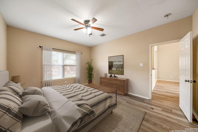 20519 View Mdw, San Antonio, TX 78258 - bedroom featuring light wood-style flooring, baseboards, and a ceiling fan