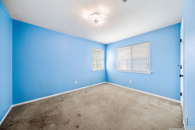 20519 View Mdw, San Antonio, TX 78258 - carpeted empty room with baseboards