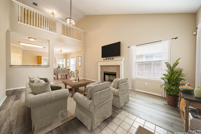 20519 View Mdw, San Antonio, TX 78258 - tiled living area featuring high vaulted ceiling, a tiled fireplace, and baseboards