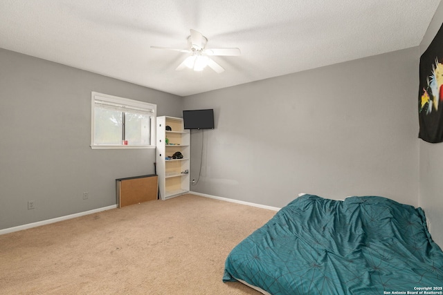 402 Teakwood, Victoria, TX 77901 - carpeted bedroom with baseboards, ceiling fan, and a textured ceiling