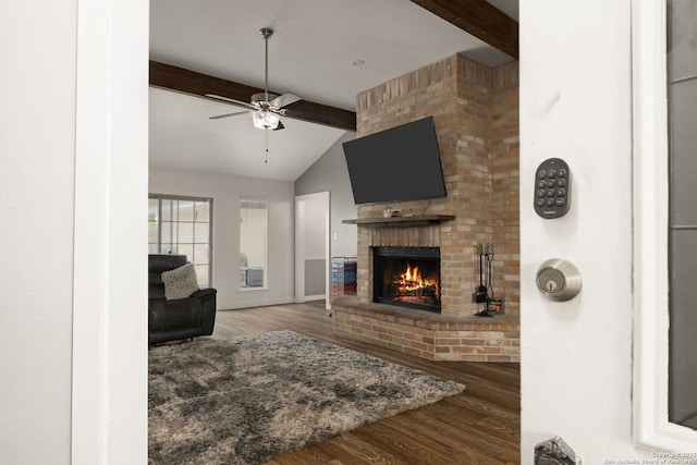 402 Teakwood, Victoria, TX 77901 - living area with a brick fireplace, wood finished floors, ceiling fan, and baseboards