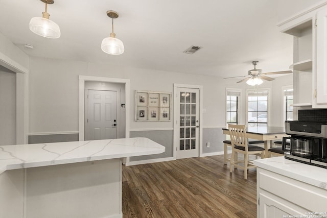 402 Teakwood, Victoria, TX 77901 - kitchen featuring white cabinets, a ceiling fan, dark wood-type flooring, and hanging light fixtures