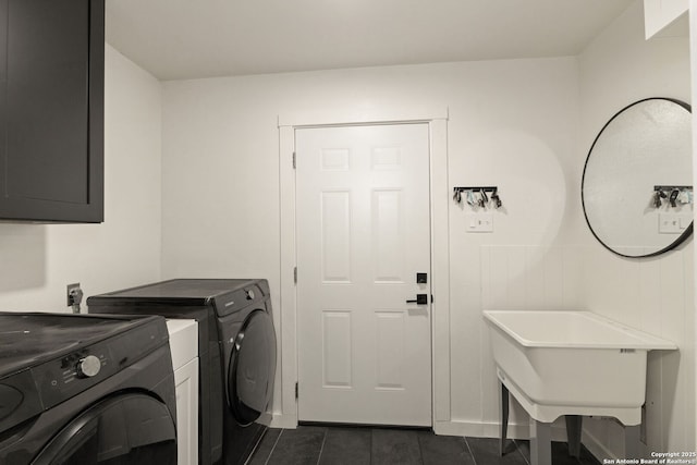 402 Teakwood, Victoria, TX 77901 - washroom featuring washer and clothes dryer, dark tile patterned flooring, and baseboards