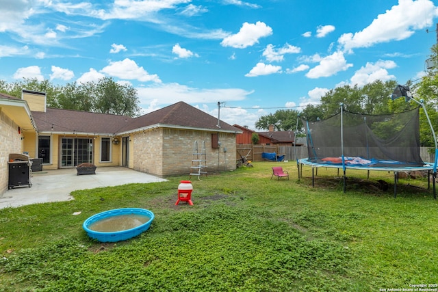 402 Teakwood, Victoria, TX 77901 - view of yard with a trampoline and a patio