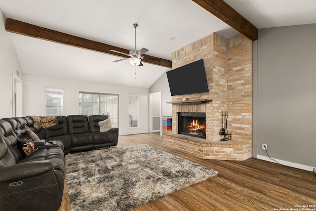 402 Teakwood, Victoria, TX 77901 - living room with ceiling fan, a fireplace, wood finished floors, and baseboards
