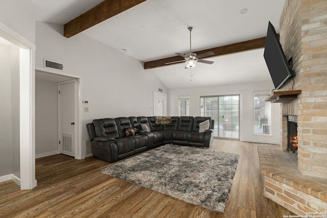 402 Teakwood, Victoria, TX 77901 - living room featuring a brick fireplace, ceiling fan, wood finished floors, and baseboards