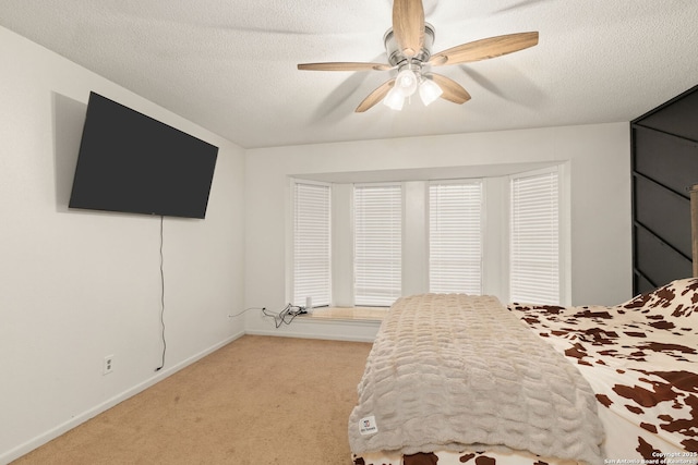 402 Teakwood, Victoria, TX 77901 - bedroom with light carpet, baseboards, a ceiling fan, and a textured ceiling