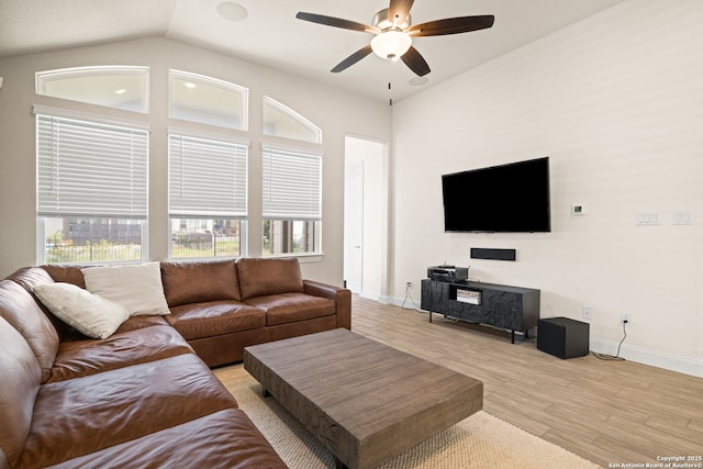 529 Huntwick, Boerne, TX 78006 - living room featuring a ceiling fan, baseboards, light wood-type flooring, and vaulted ceiling