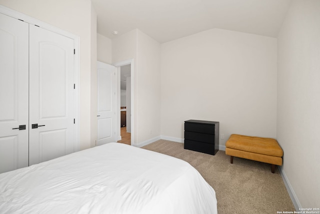 529 Huntwick, Boerne, TX 78006 - bedroom featuring light colored carpet, baseboards, vaulted ceiling, and a closet
