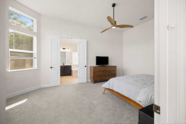 529 Huntwick, Boerne, TX 78006 - bedroom with light carpet, baseboards, ensuite bath, vaulted ceiling, and a ceiling fan
