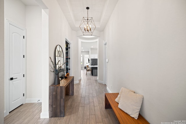 529 Huntwick, Boerne, TX 78006 - hall with light wood-style floors, a chandelier, and baseboards