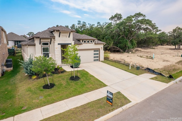 529 Huntwick, Boerne, TX 78006 - view of front of home with stucco siding, concrete driveway, roof with shingles, an attached garage, and central AC