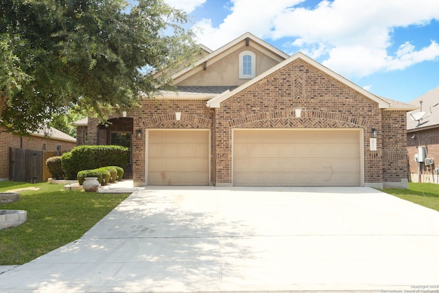 8955 Highland Dawn, San Antonio, TX 78254 - view of front of home with driveway, an attached garage, and brick siding