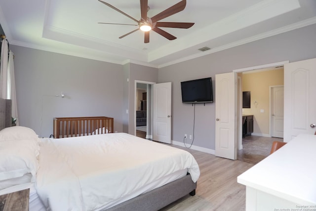 8955 Highland Dawn, San Antonio, TX 78254 - bedroom featuring a raised ceiling, light wood finished floors, ornamental molding, a ceiling fan, and baseboards