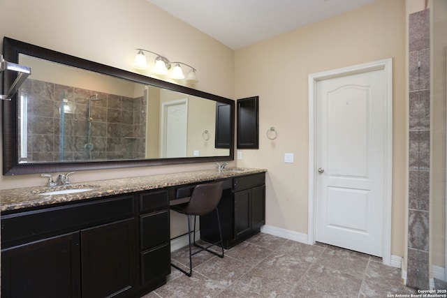 8955 Highland Dawn, San Antonio, TX 78254 - bathroom featuring double vanity, tiled shower, and baseboards