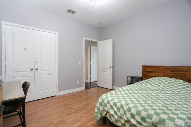 8955 Highland Dawn, San Antonio, TX 78254 - bedroom with light wood-type flooring, a closet, baseboards, and a desk