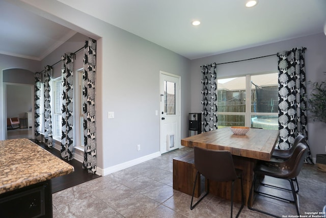 8955 Highland Dawn, San Antonio, TX 78254 - dining room with recessed lighting, baseboards, tile patterned floors, and crown molding