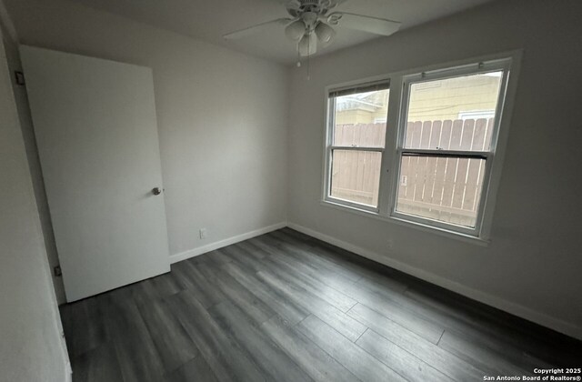 102 Killarney Dr, San Antonio, TX 78223 - spare room featuring baseboards, ceiling fan, and dark wood-type flooring