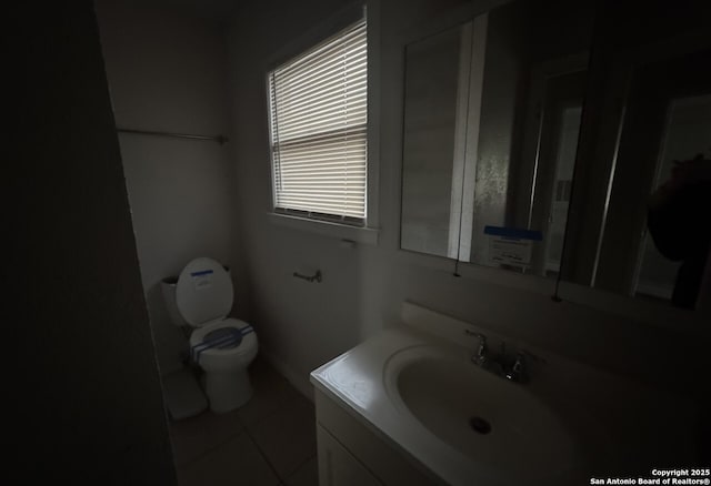102 Killarney Dr, San Antonio, TX 78223 - bathroom featuring toilet, vanity, and tile patterned flooring