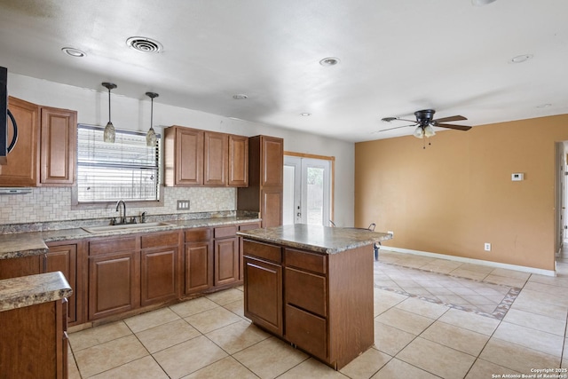 4503 Tropical, San Antonio, TX 78218 - kitchen featuring a sink, plenty of natural light, backsplash, light tile patterned floors, and recessed lighting