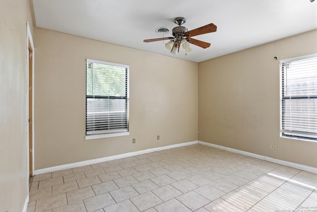 4503 Tropical, San Antonio, TX 78218 - unfurnished room with a ceiling fan, light tile patterned floors, and baseboards