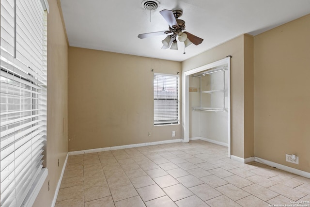 4503 Tropical, San Antonio, TX 78218 - unfurnished bedroom with light tile patterned flooring, baseboards, a ceiling fan, and a closet