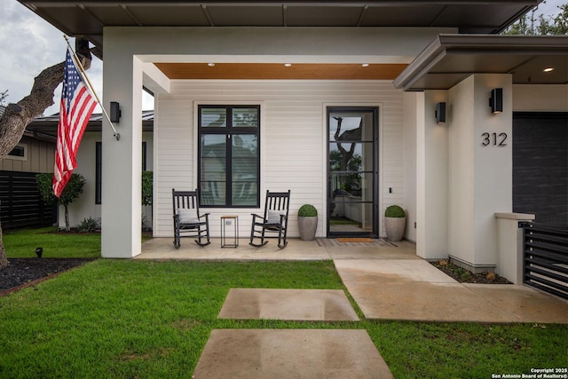 312 Frey, Boerne, TX 78006 - view of exterior entry featuring a porch and a yard