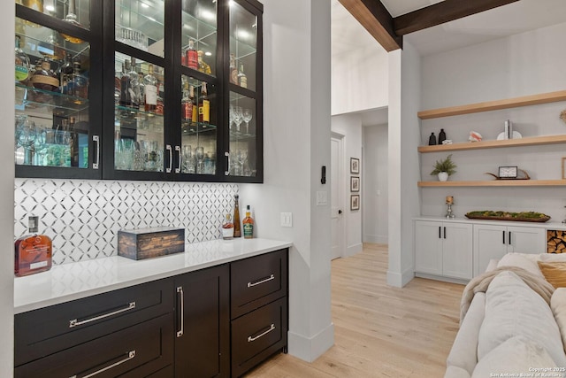 312 Frey, Boerne, TX 78006 - indoor dry bar with light wood finished floors, baseboards, backsplash, and beam ceiling