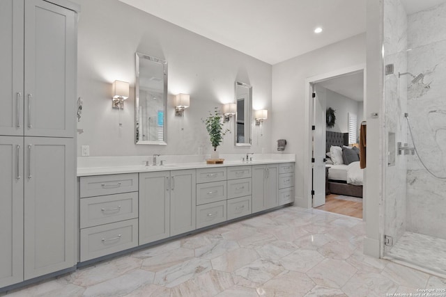 312 Frey, Boerne, TX 78006 - ensuite bathroom with a marble finish shower, double vanity, and recessed lighting