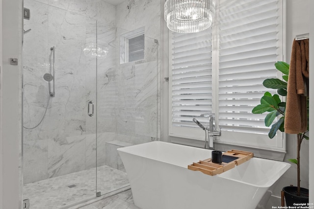 312 Frey, Boerne, TX 78006 - bathroom featuring a chandelier, a marble finish shower, a freestanding bath, and marble look tile flooring