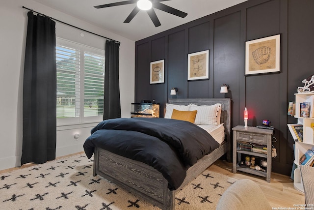 312 Frey, Boerne, TX 78006 - bedroom with a decorative wall, a ceiling fan, and light wood-style flooring