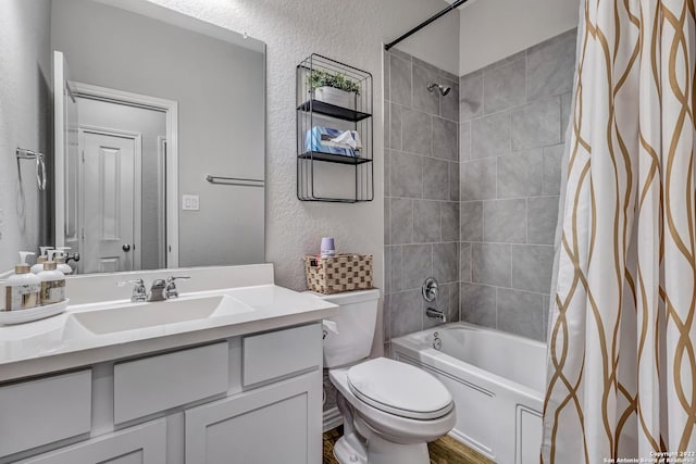 8922 Trail Dust, San Antonio, TX 78254 - full bathroom with a textured wall, toilet, vanity, and shower / bathtub combination with curtain